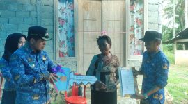Bupati Dr. Sirajudin Lasena, SE, M.Ec.Dev., didampingi Wakil Bupati Moh. Aditya Pontoh, S.IP. Acara ditandai dengan penyerahan kunci rumah oleh Bupati kepada penerima manfaat, serta penyerahan sertifikat rumah oleh Wakil Bupati